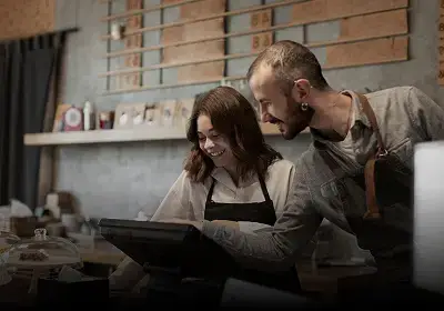 Restaurant staff managing orders with ERP software support